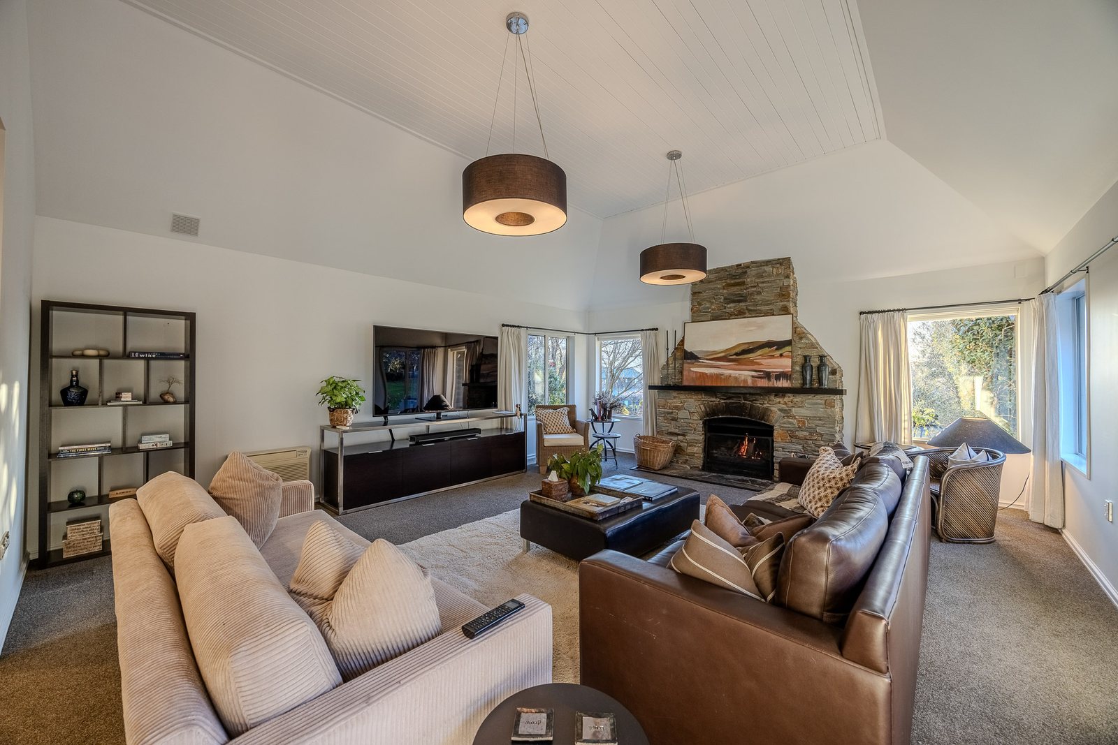 Fireside lounge with schist stone hearth at Mishika Retreat